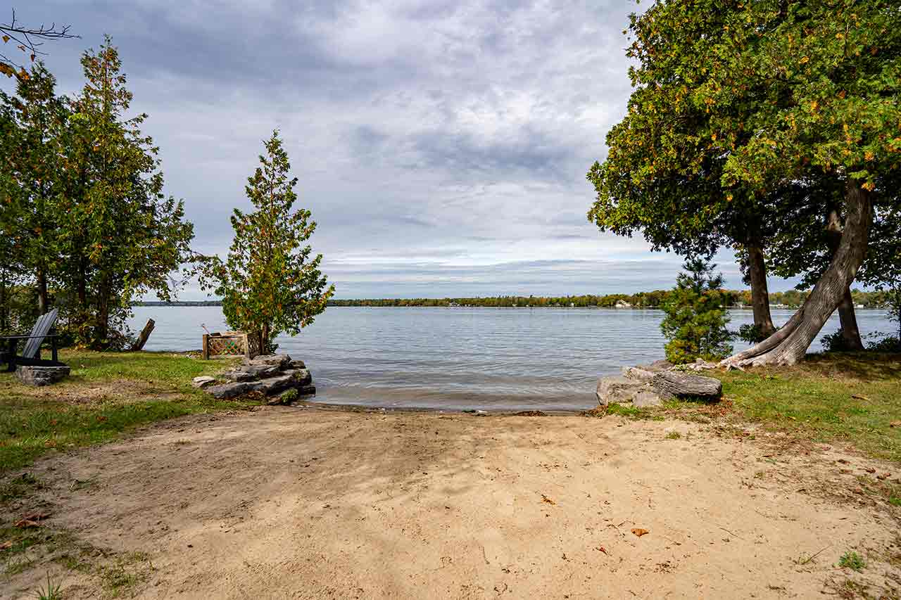 No weeds sandy beach. Safe for children to swim. Sand toys are available by the shore & water shoes are recommended.